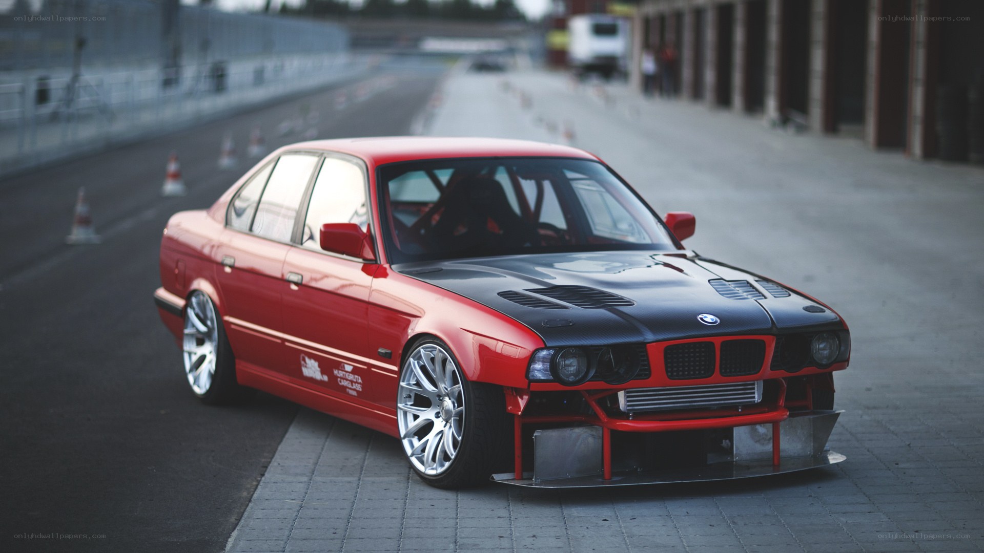 Red BMW race car on track