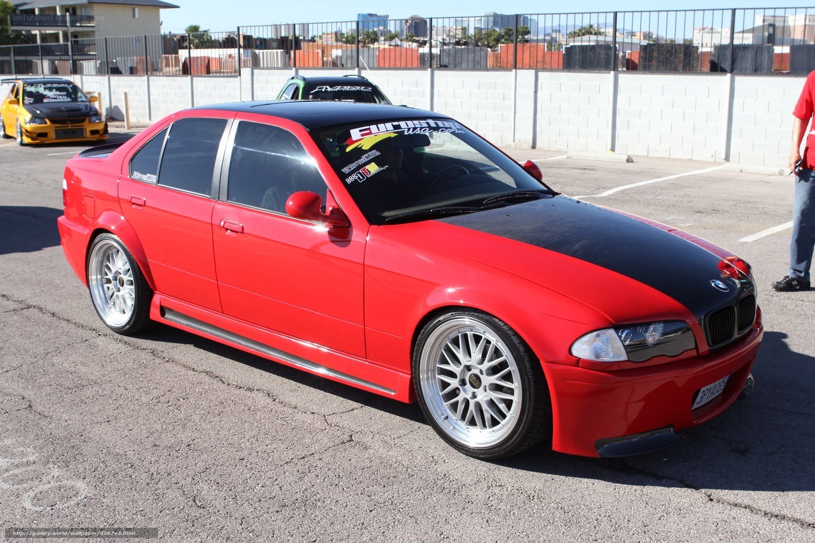 red bmw sedan at car show