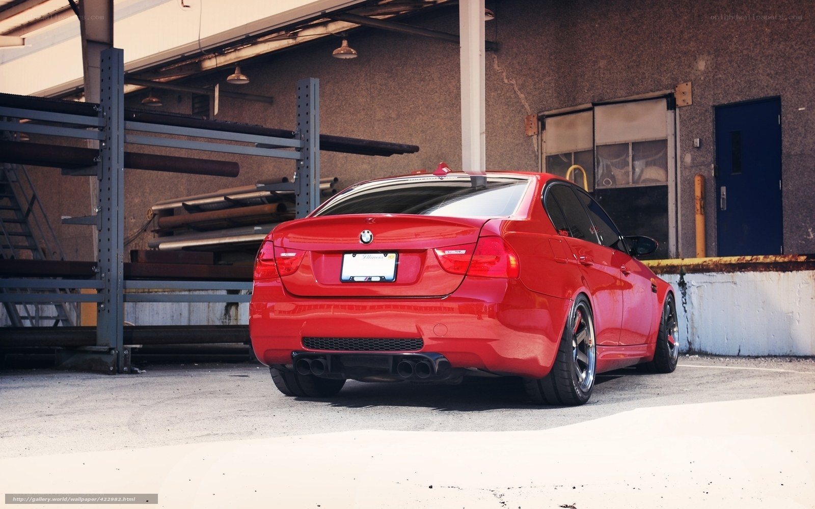 red bmw sedan in garage