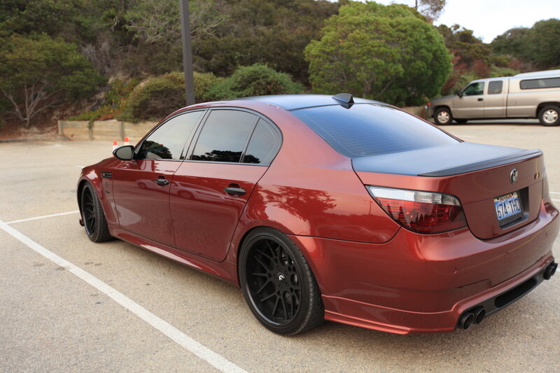red bmw sedan in parking lot