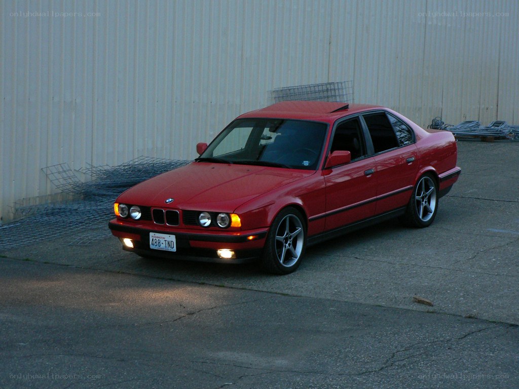 red bmw sedan parked