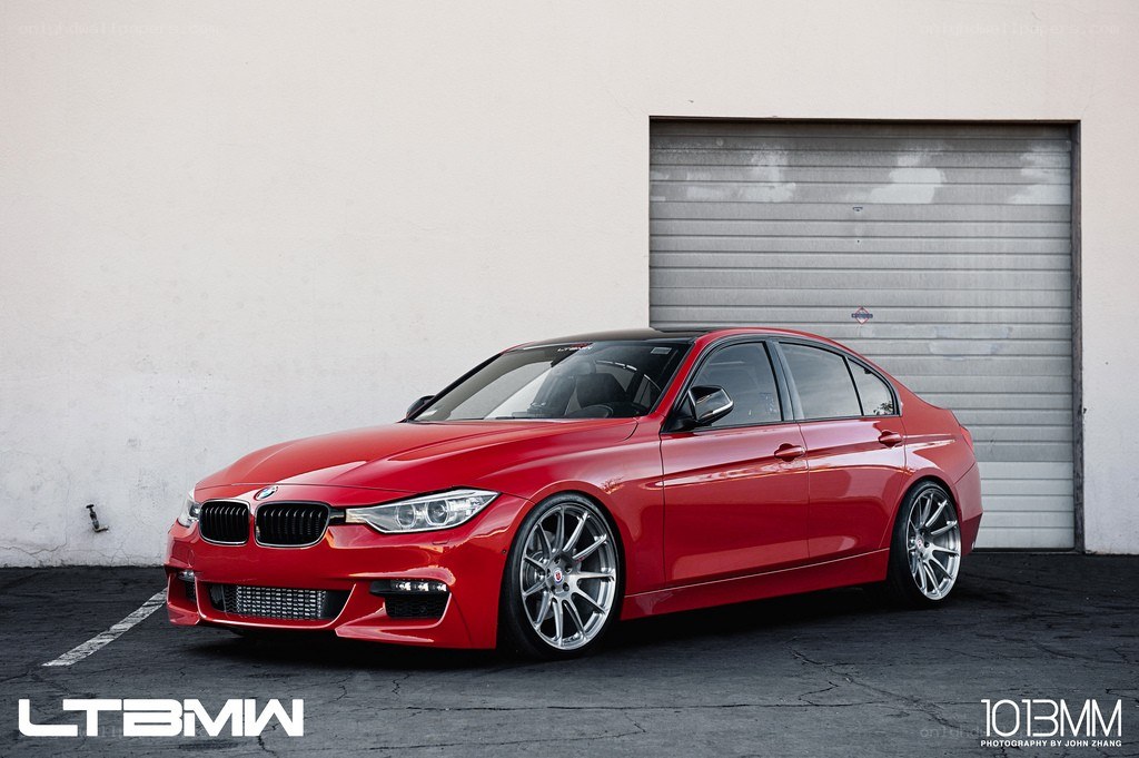 red bmw sedan parked