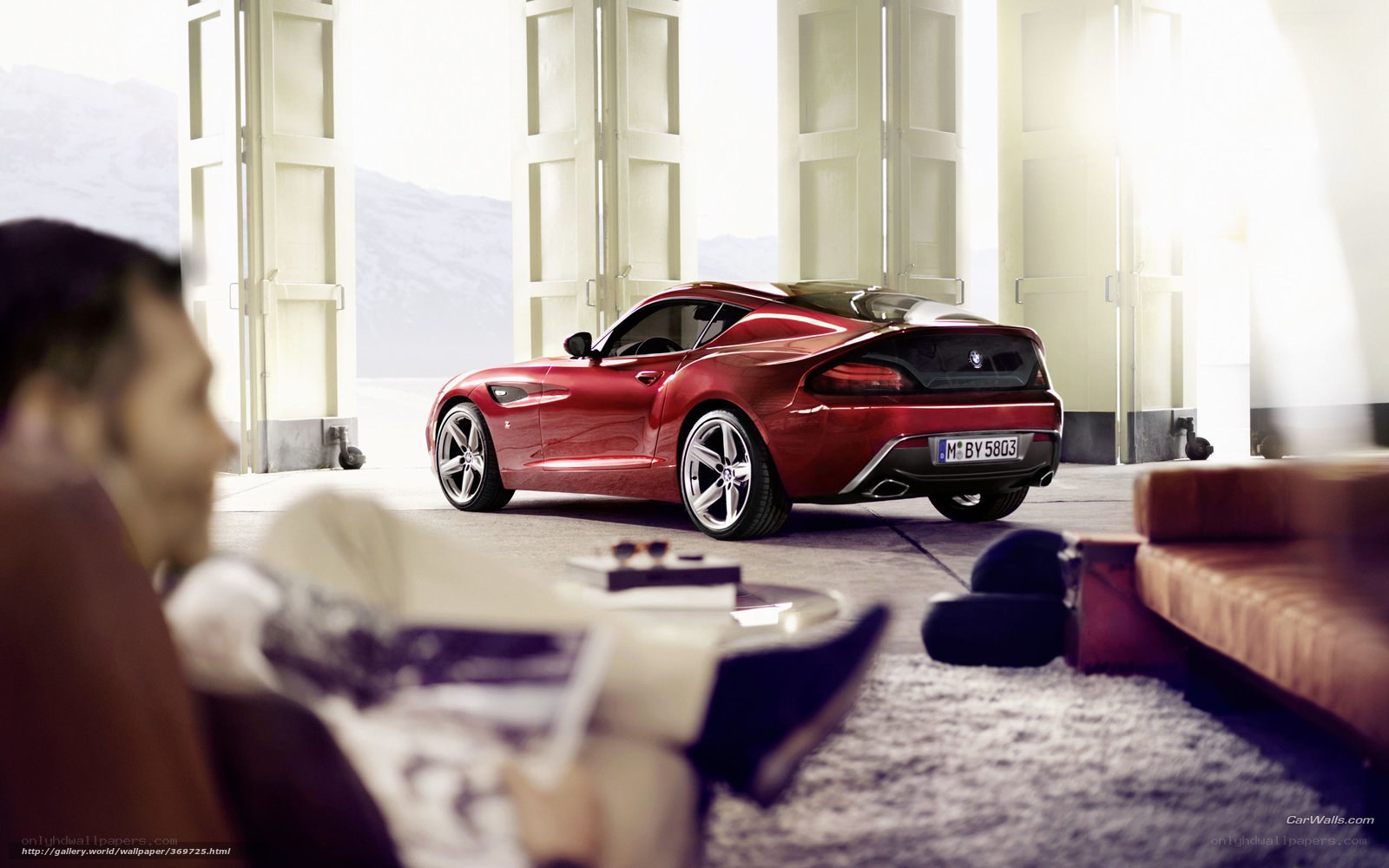 Red BMW sports car in garage