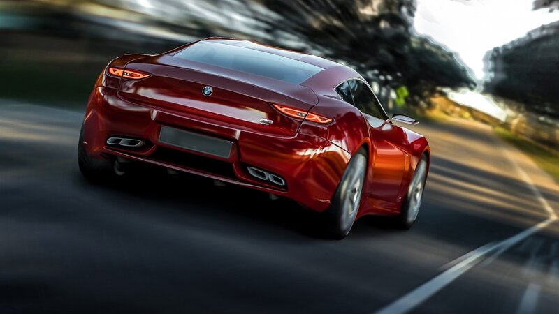 red bmw sports car in motion