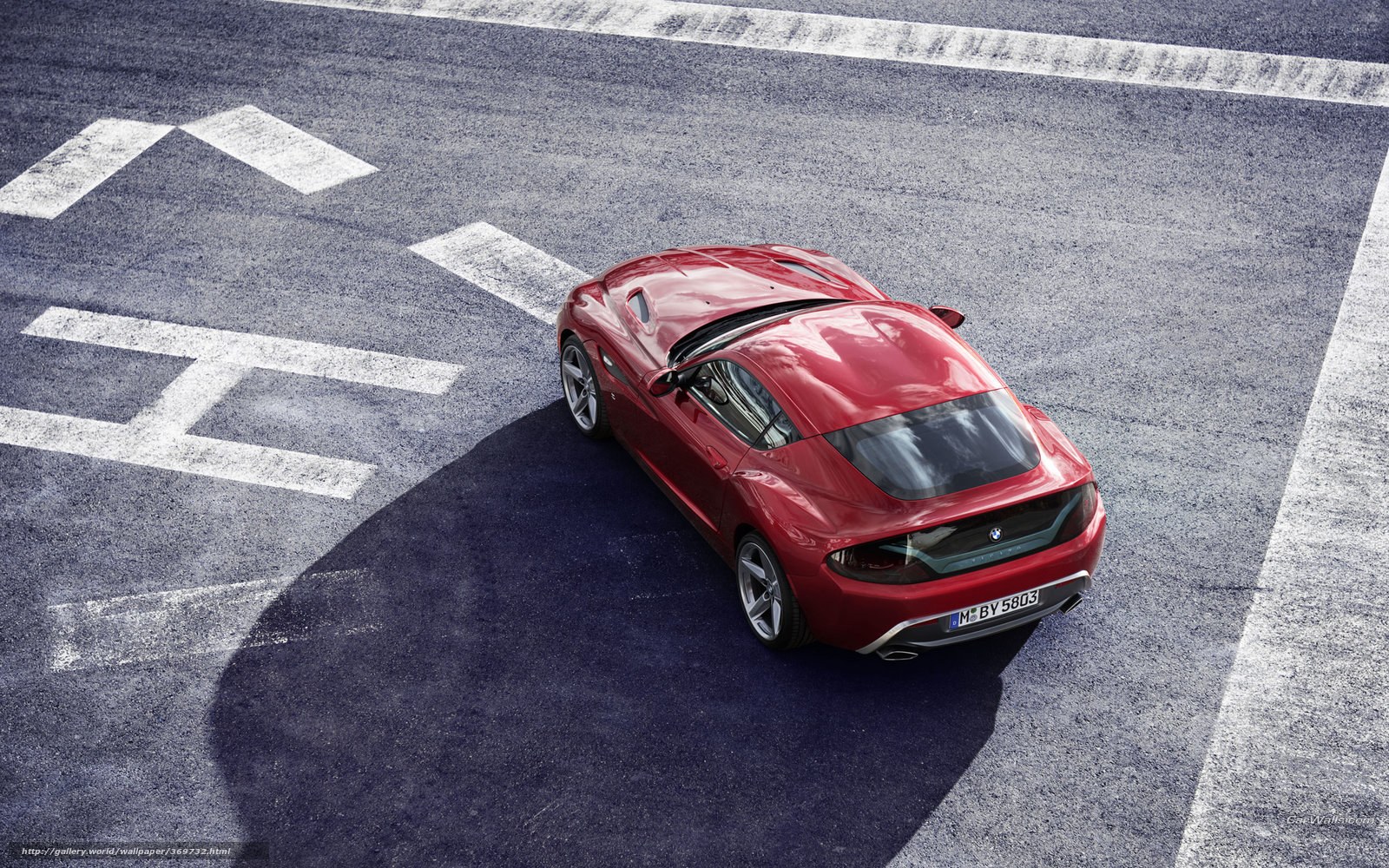 Red BMW sports car on track
