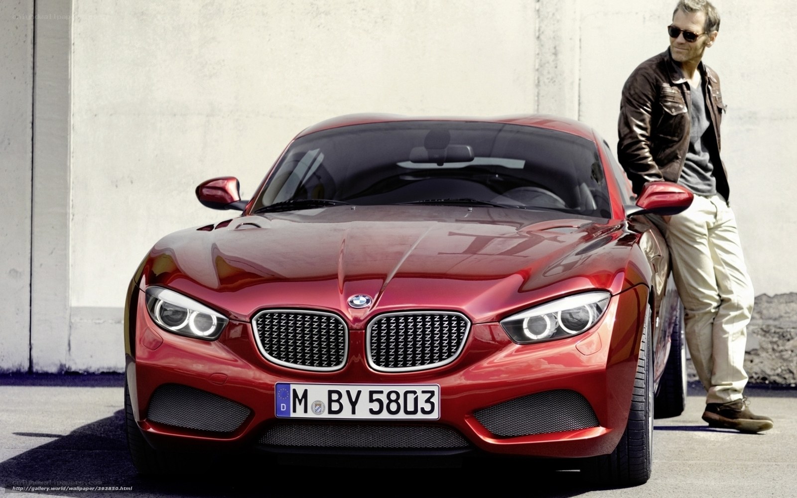 Red BMW sports car with man