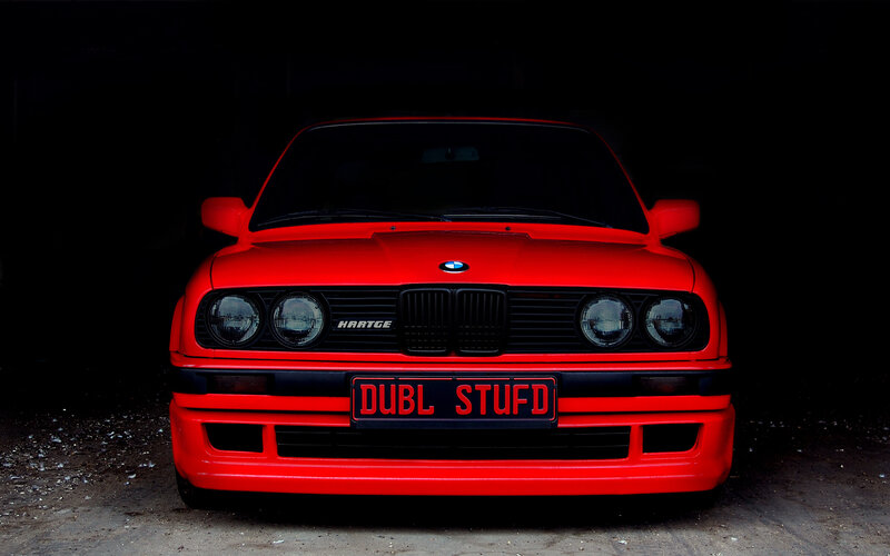 Red BMW with custom license plate