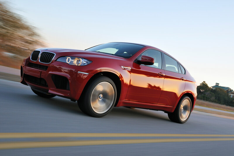 Red BMW X6 in motion