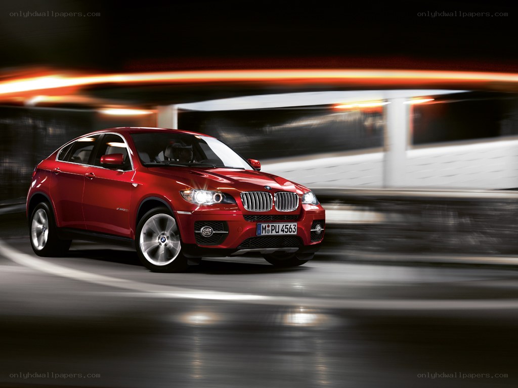 Red BMW X6 in motion