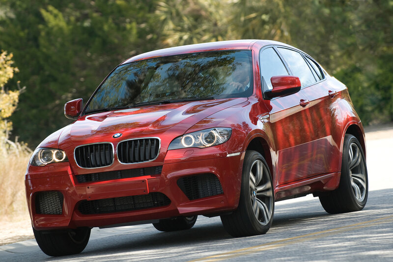 Red BMW X6 in motion