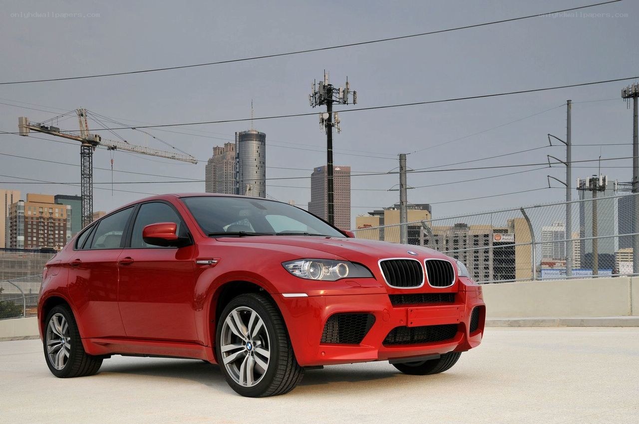 Red BMW X6 in urban setting