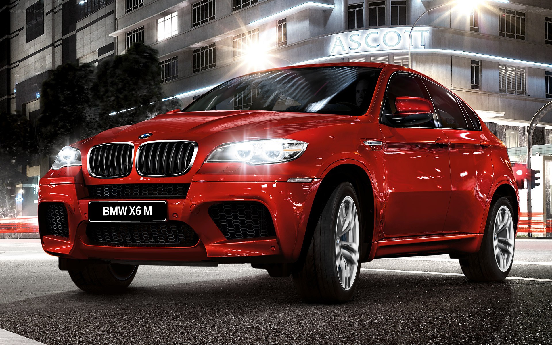 Red BMW X6 M at night