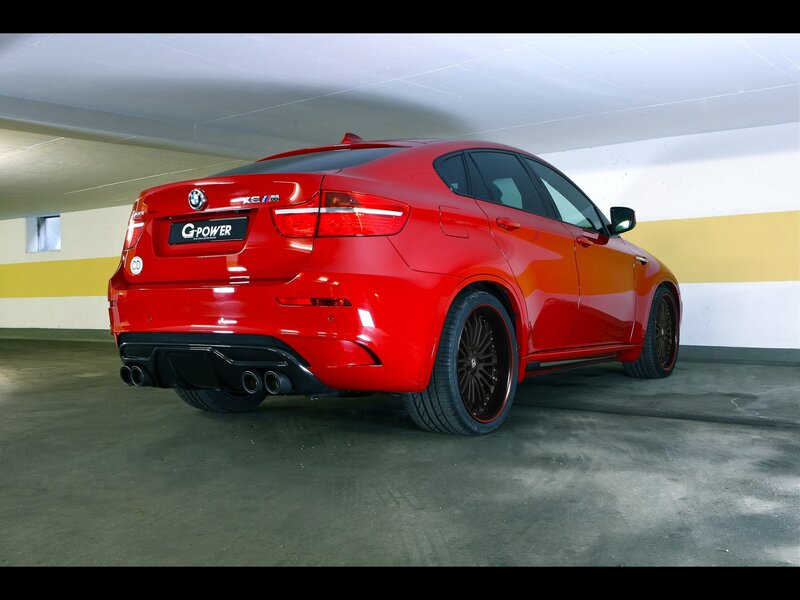 Red BMW X6 M in garage