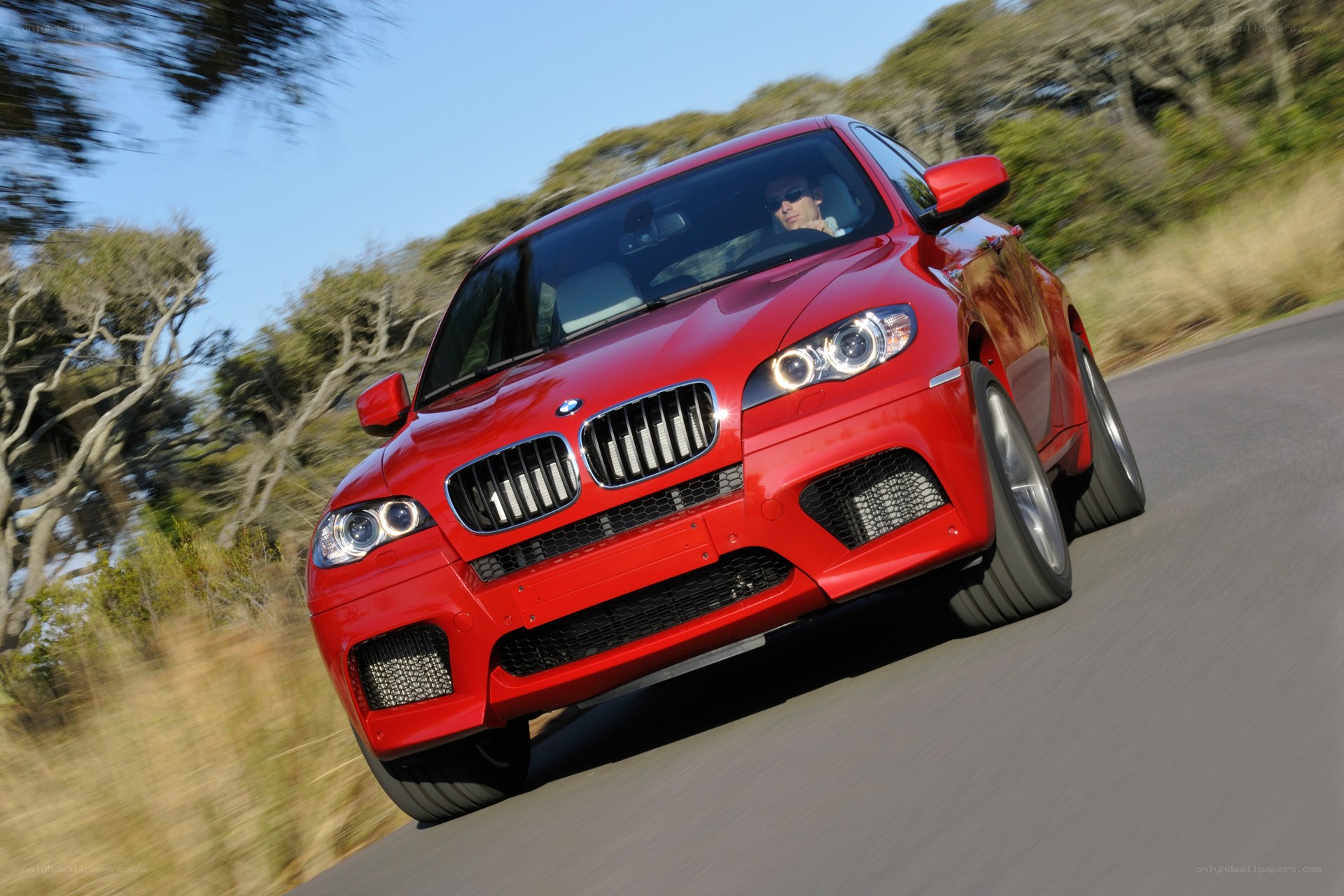 Red BMW X6 M in motion