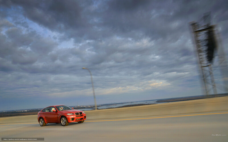 Red BMW X6 on a highway