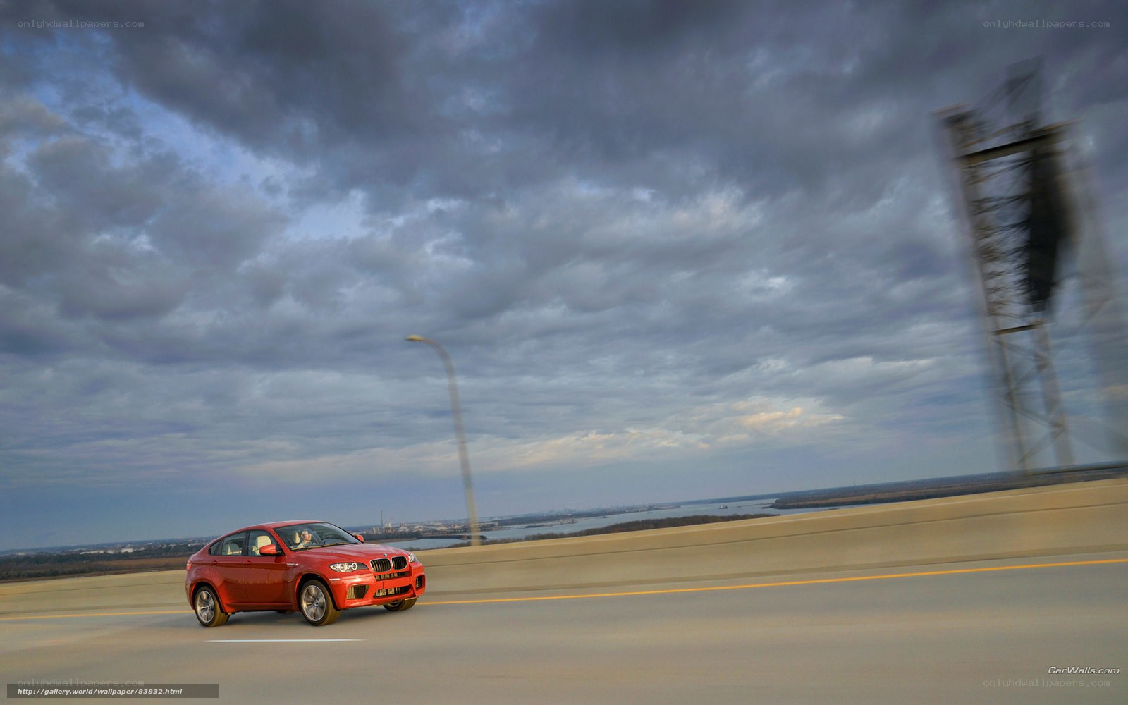 Red BMW X6 on a highway