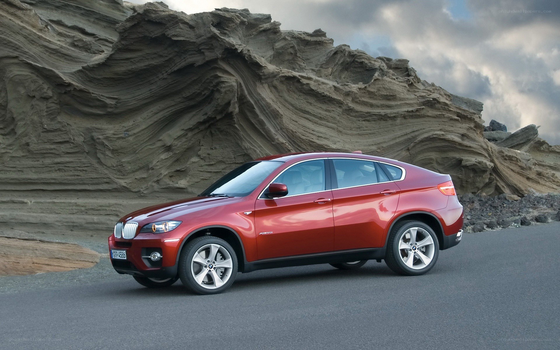 Red BMW X6 on a road