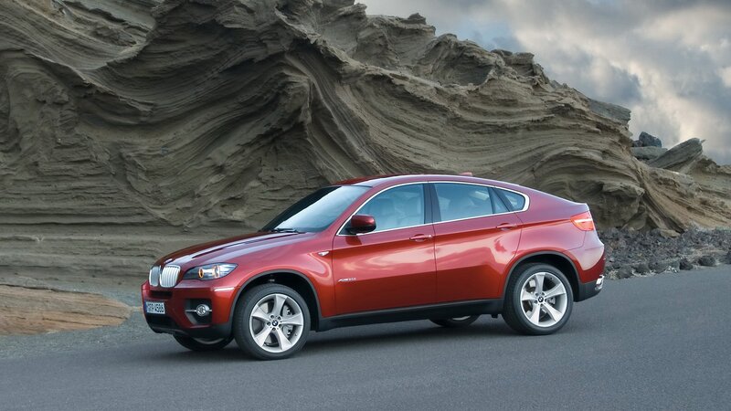 Red BMW X6 on a road