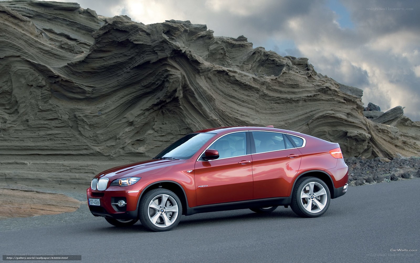 Red BMW X6 on a road