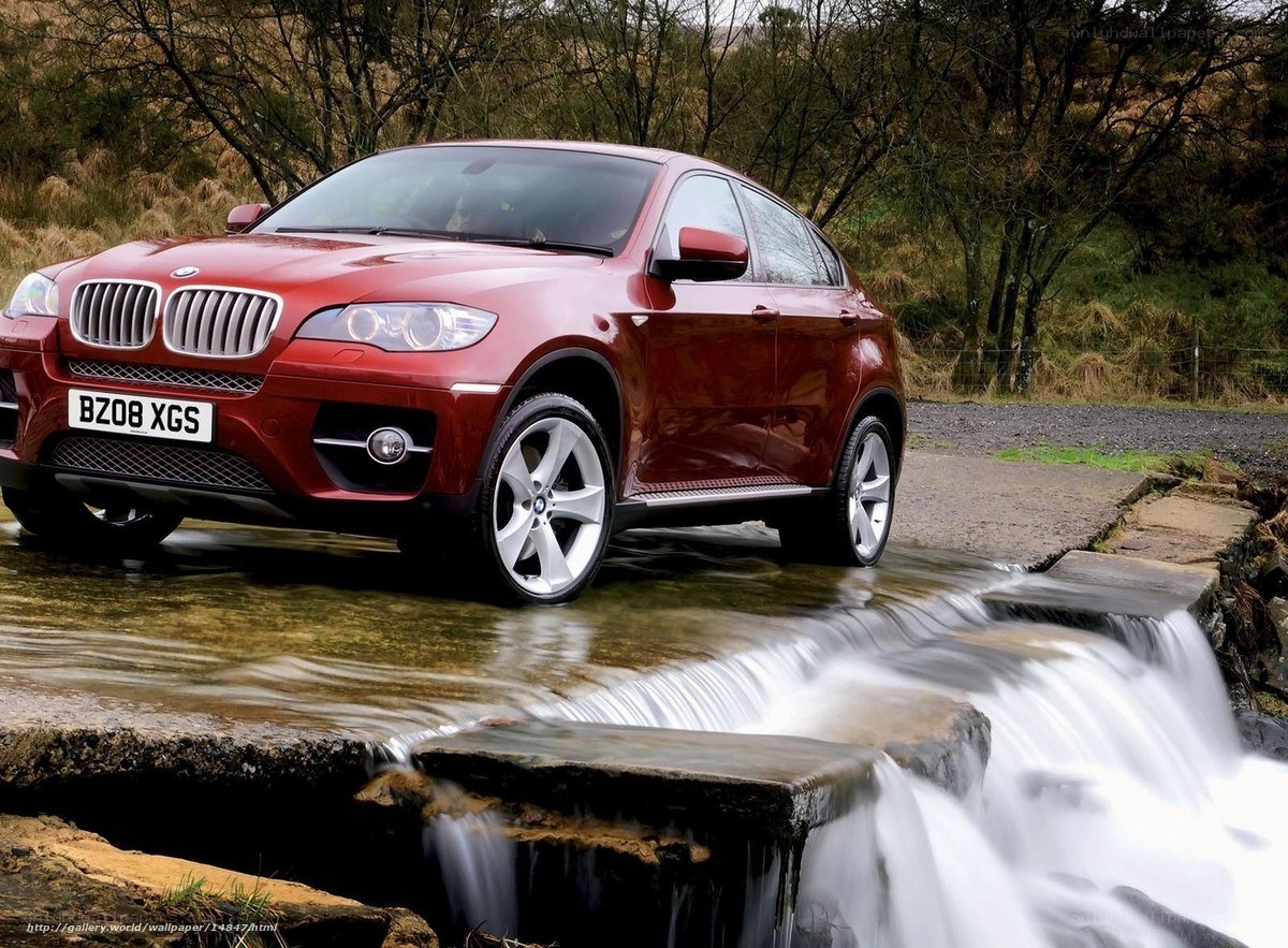 Red BMW X6 on a stream