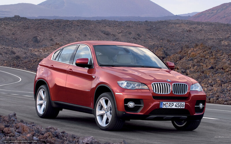 Red BMW X6 on a winding road