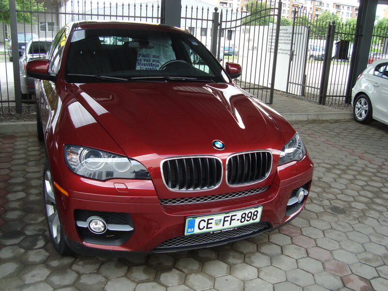 Red BMW X6 parked outside