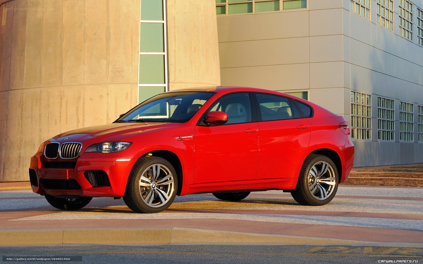Red BMW X6 parked outside