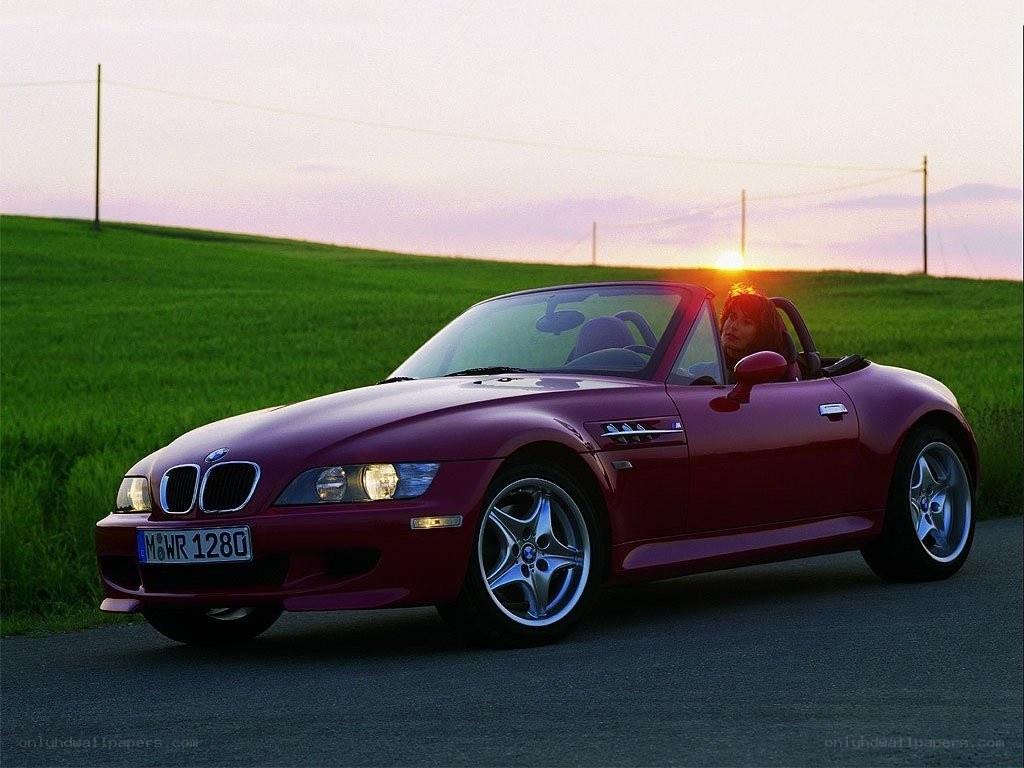 Red BMW Z3 convertible at sunset