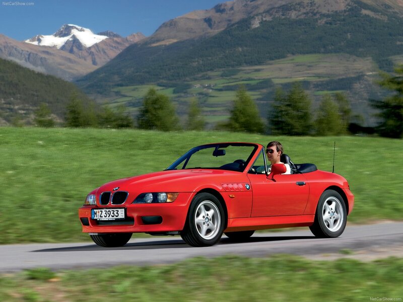 Red BMW Z3 convertible on mountain road