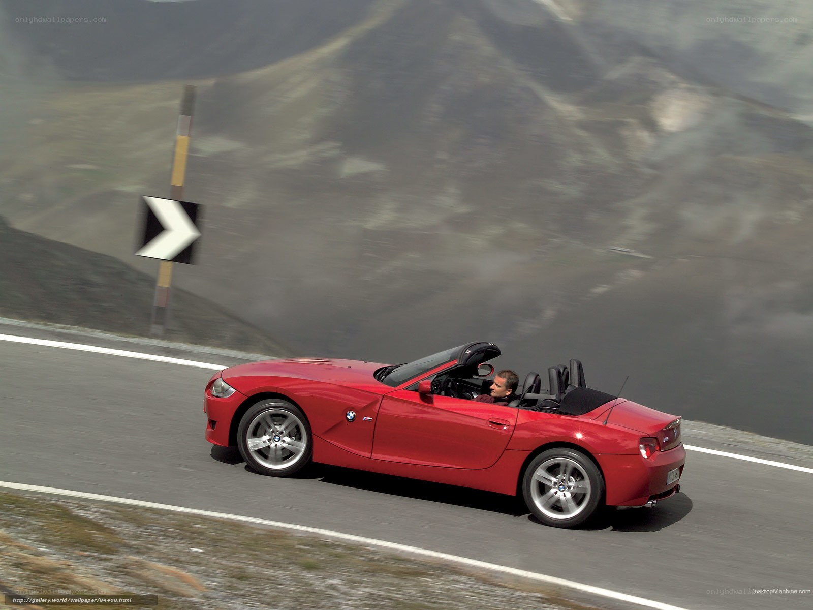 Red BMW Z4 convertible on mountain road