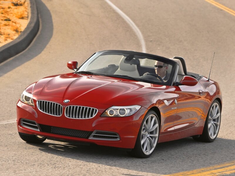 Red BMW Z4 convertible on road