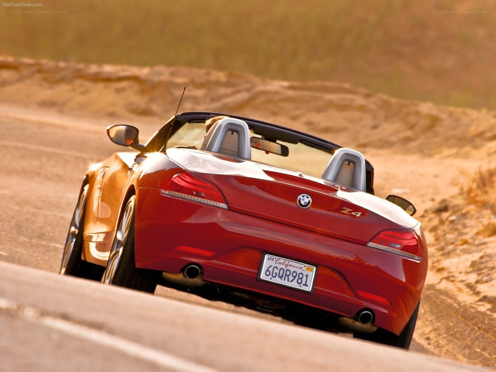 Red BMW Z4 convertible on road