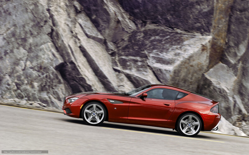 red bmw z4 driving on mountain road