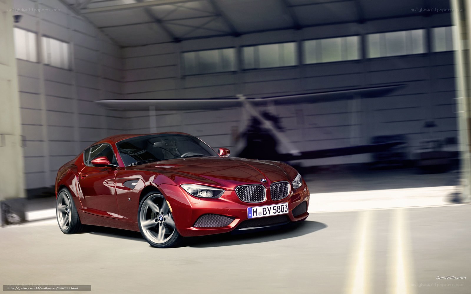 Red BMW Z4 in a hangar