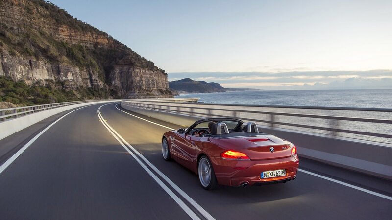 Red BMW Z4 on coastal road