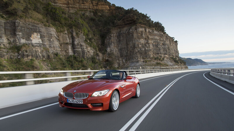 Red BMW Z4 on coastal road