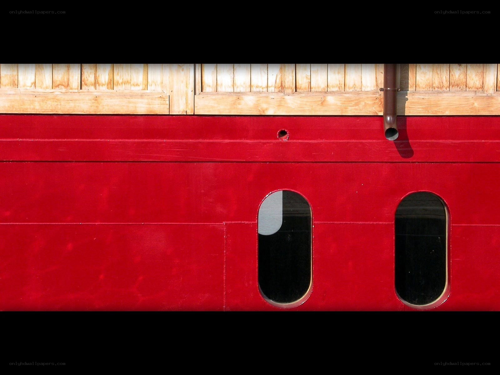 red boat hull with windows