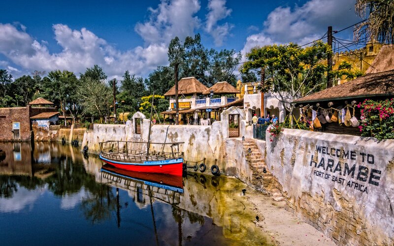 Red Boat in Canal — Blue