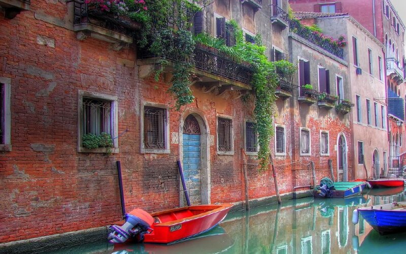 Red Boat in Canal — Serene