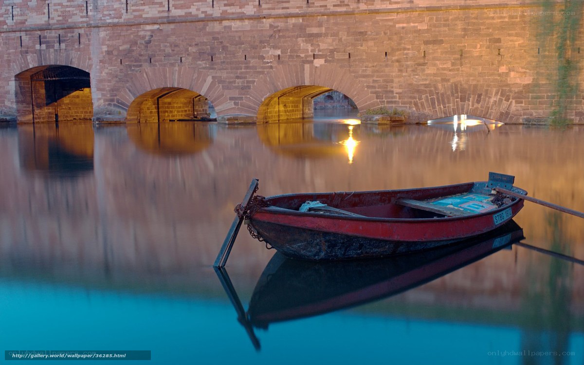 Red boat on a calm river