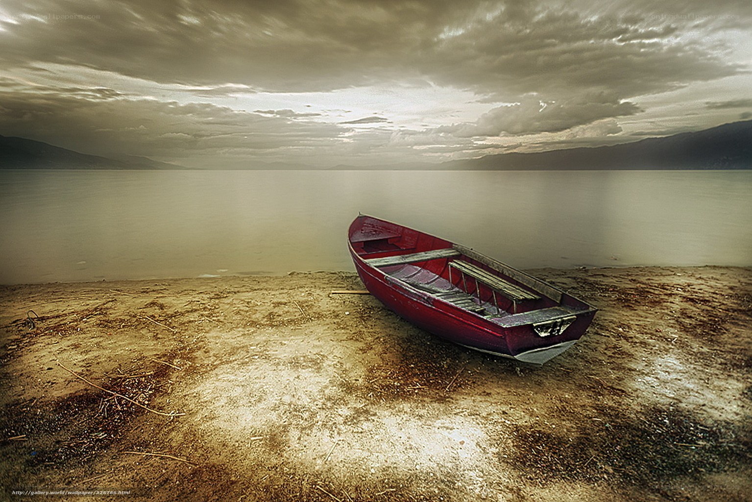 Red boat on a quiet shore