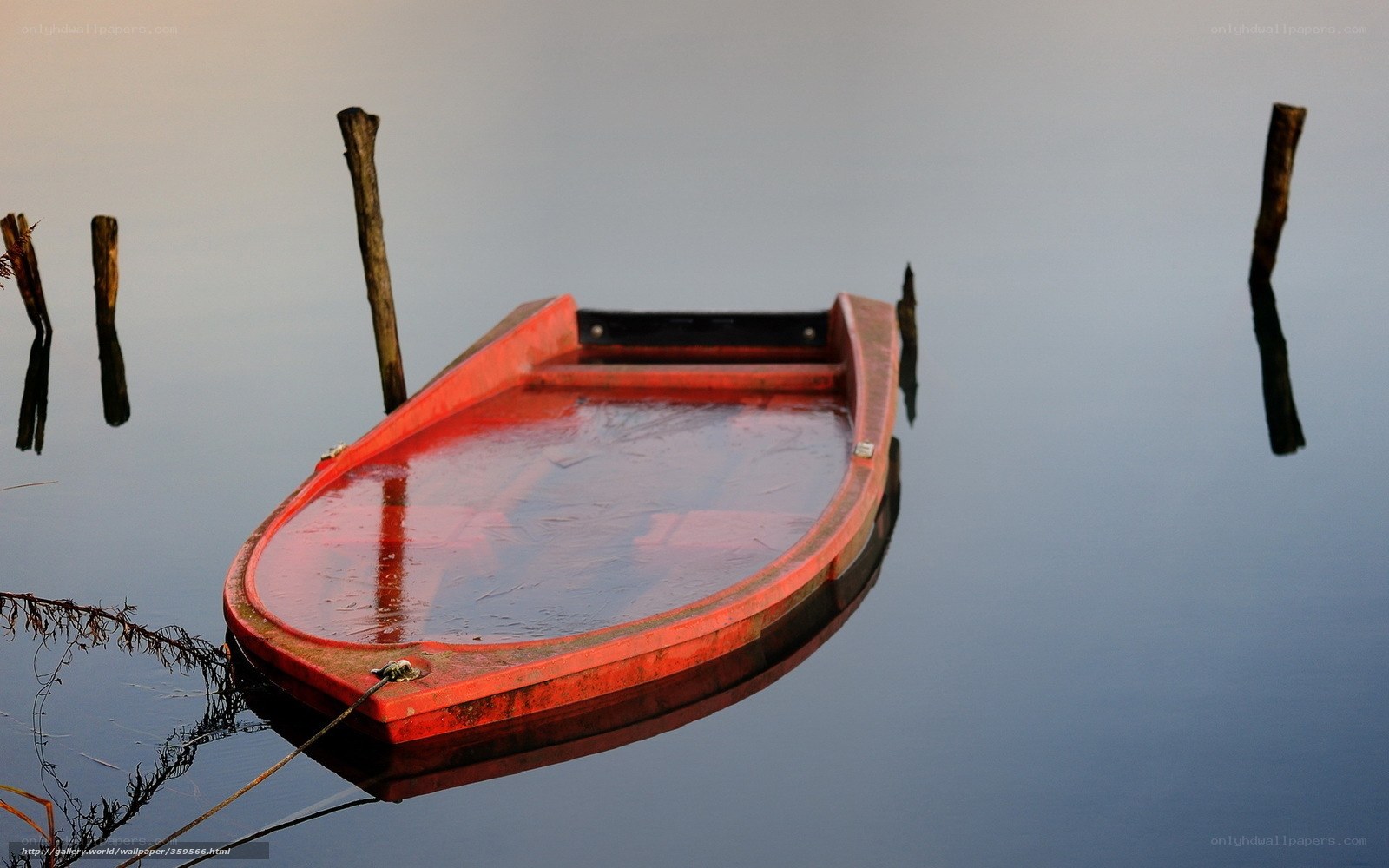 Red boat on calm water