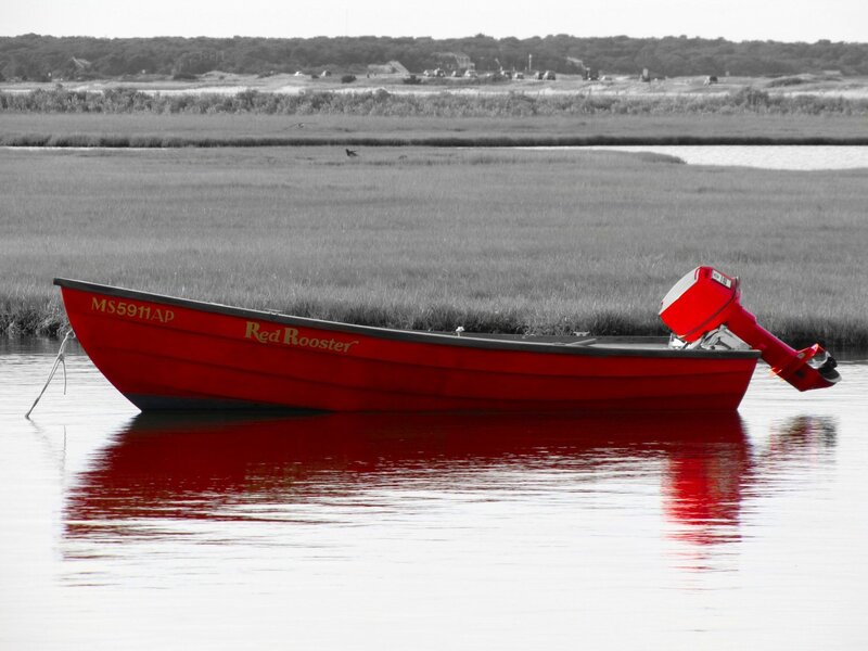 Red boat on calm water