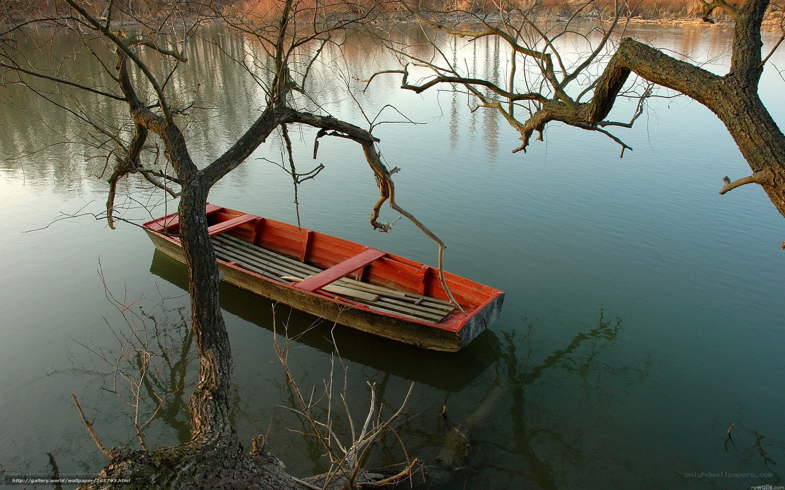 Red boat on calm water