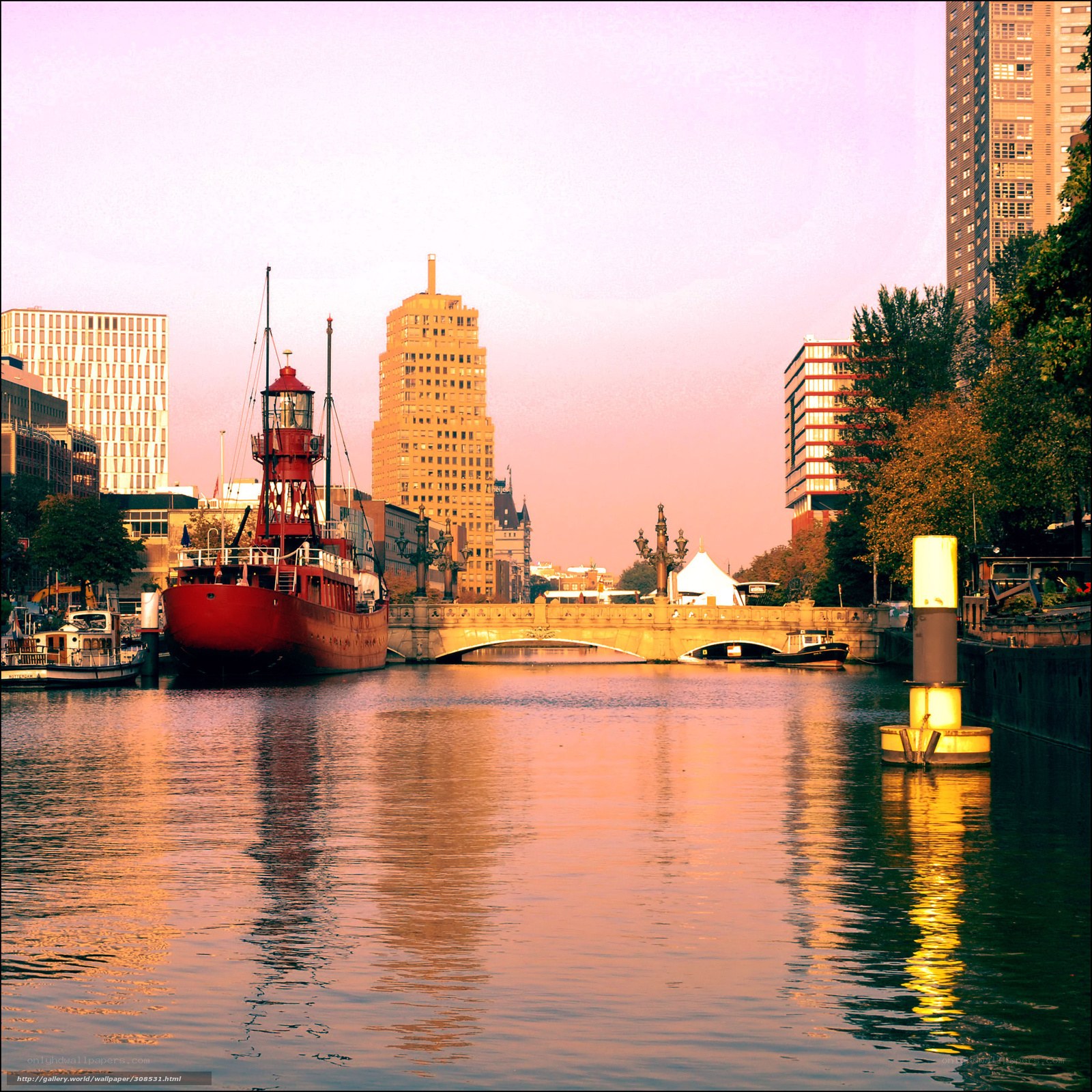 Red boat on canal at sunset