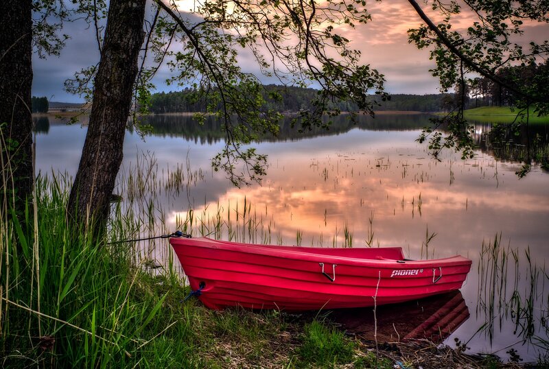Red Boat on Lake Shore — Serene