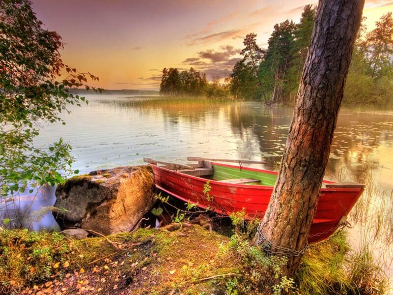Red Boat on Lake Shore
