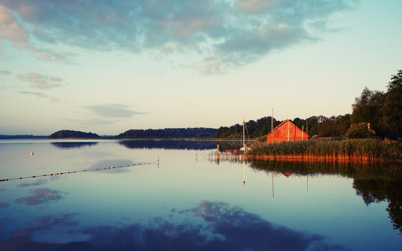 Red boathouse at sunset