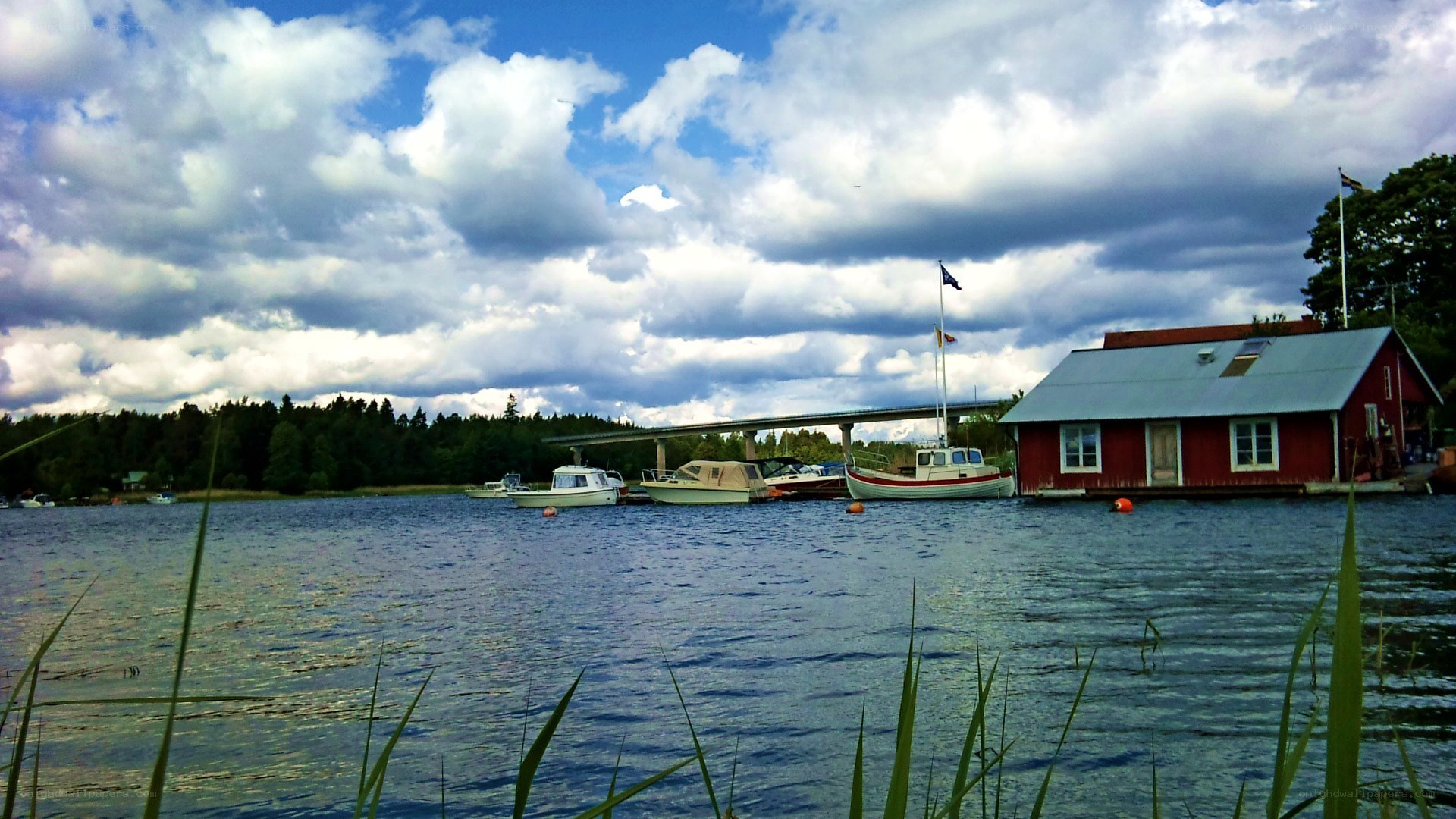 Red boathouse on a lake