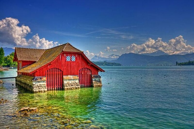 Red Boathouse on Lake — Blue